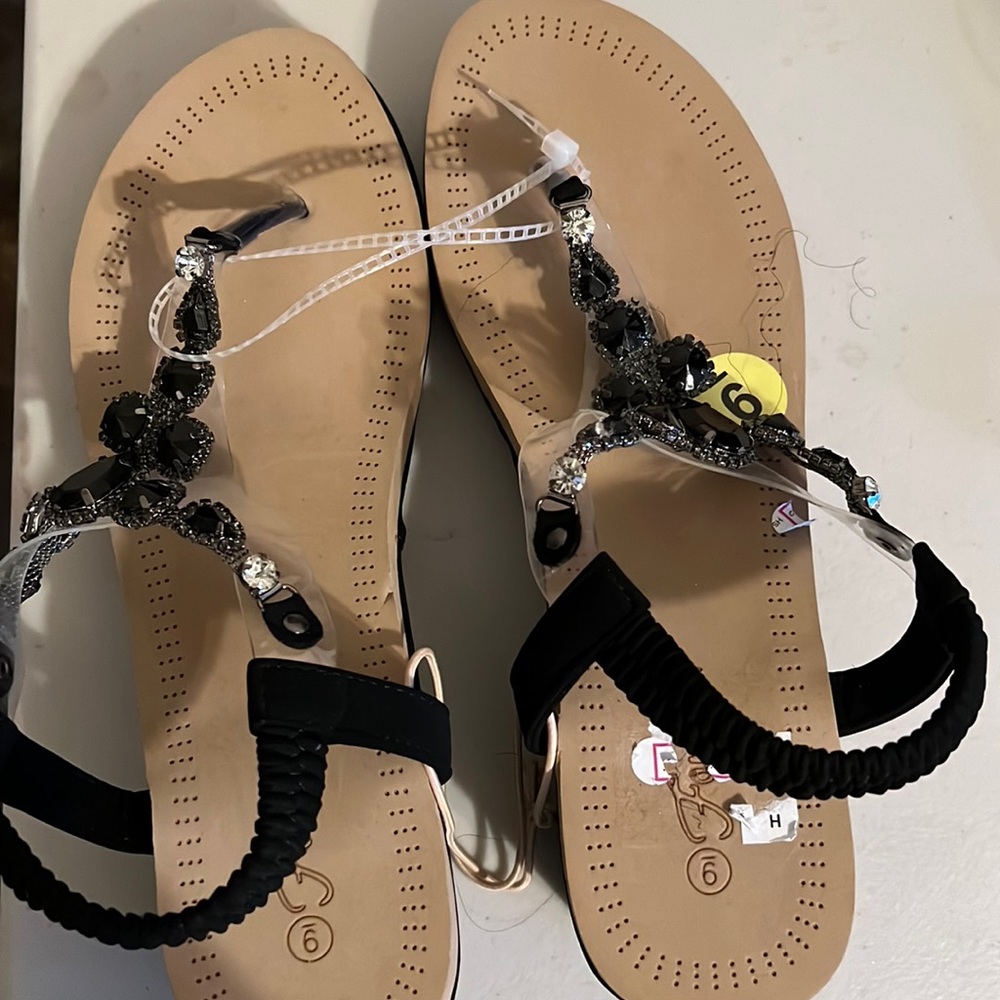 Black Size 9 beautiful leather sandals. New .